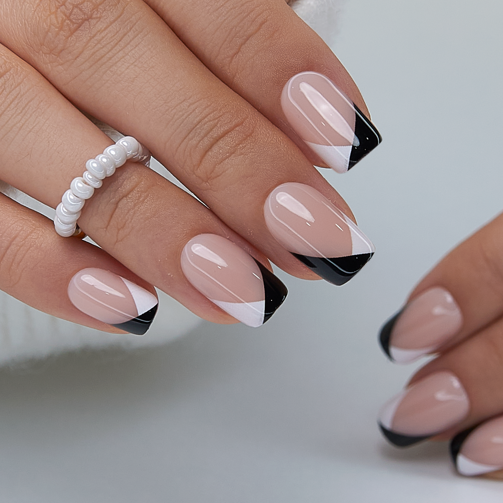 Minimal Contrast medium squoval press-on nails worn on a hand