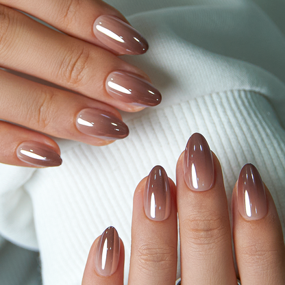 Mocha Chrome short almond press-on nails worn on a hand