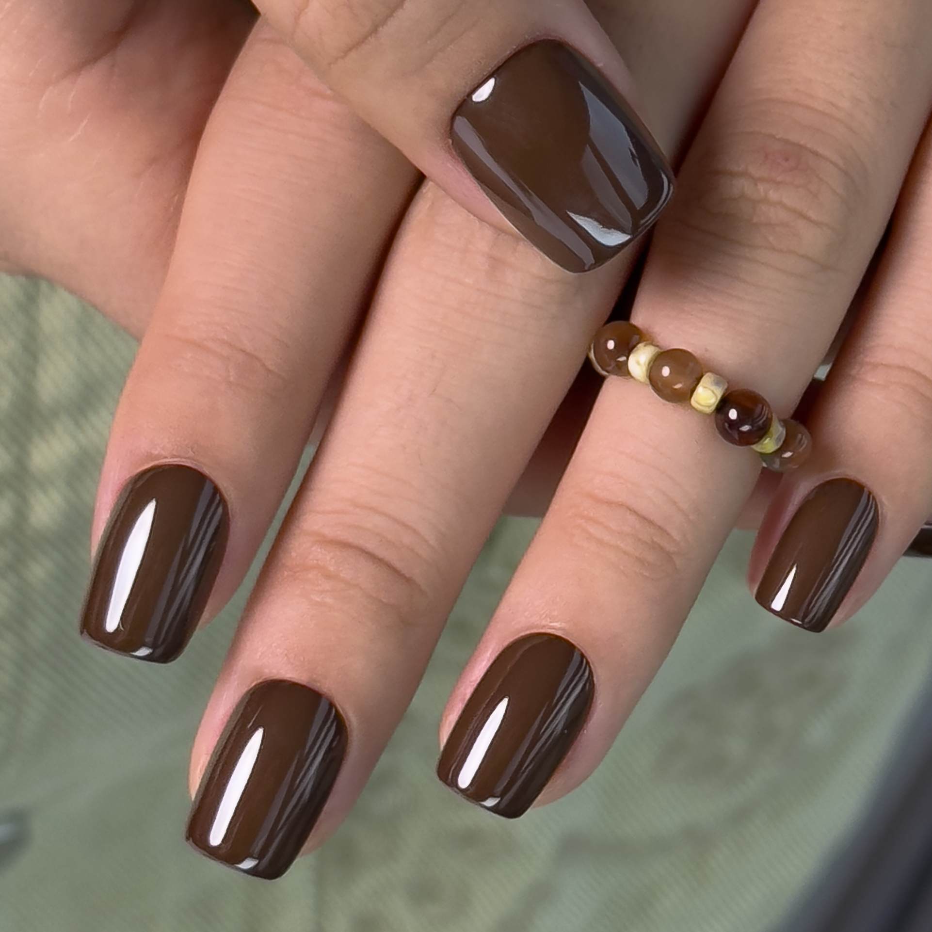 Mocha Essence short squoval nail detail