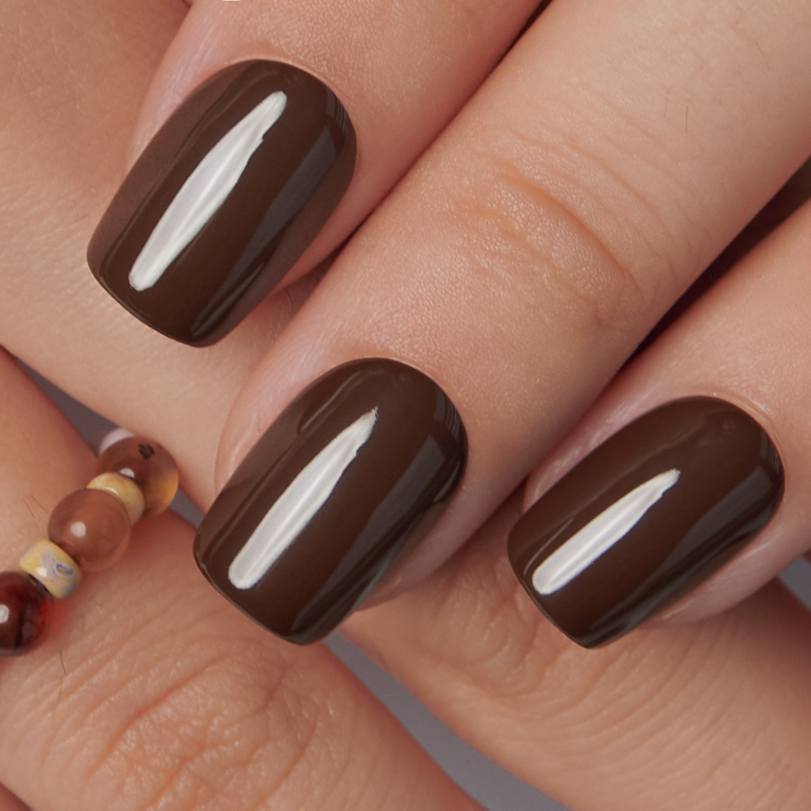 Mocha Essence short squoval press-on nails from the side