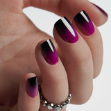 Mysterious Purple short squoval Ver 2 press-on nails worn on a hand