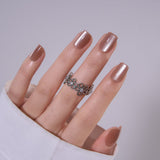 Nude Cat Grace medium squoval press-on nails worn on a hand