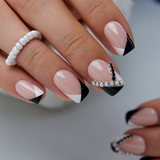 Nude French medium squoval press-on nails worn on a hand