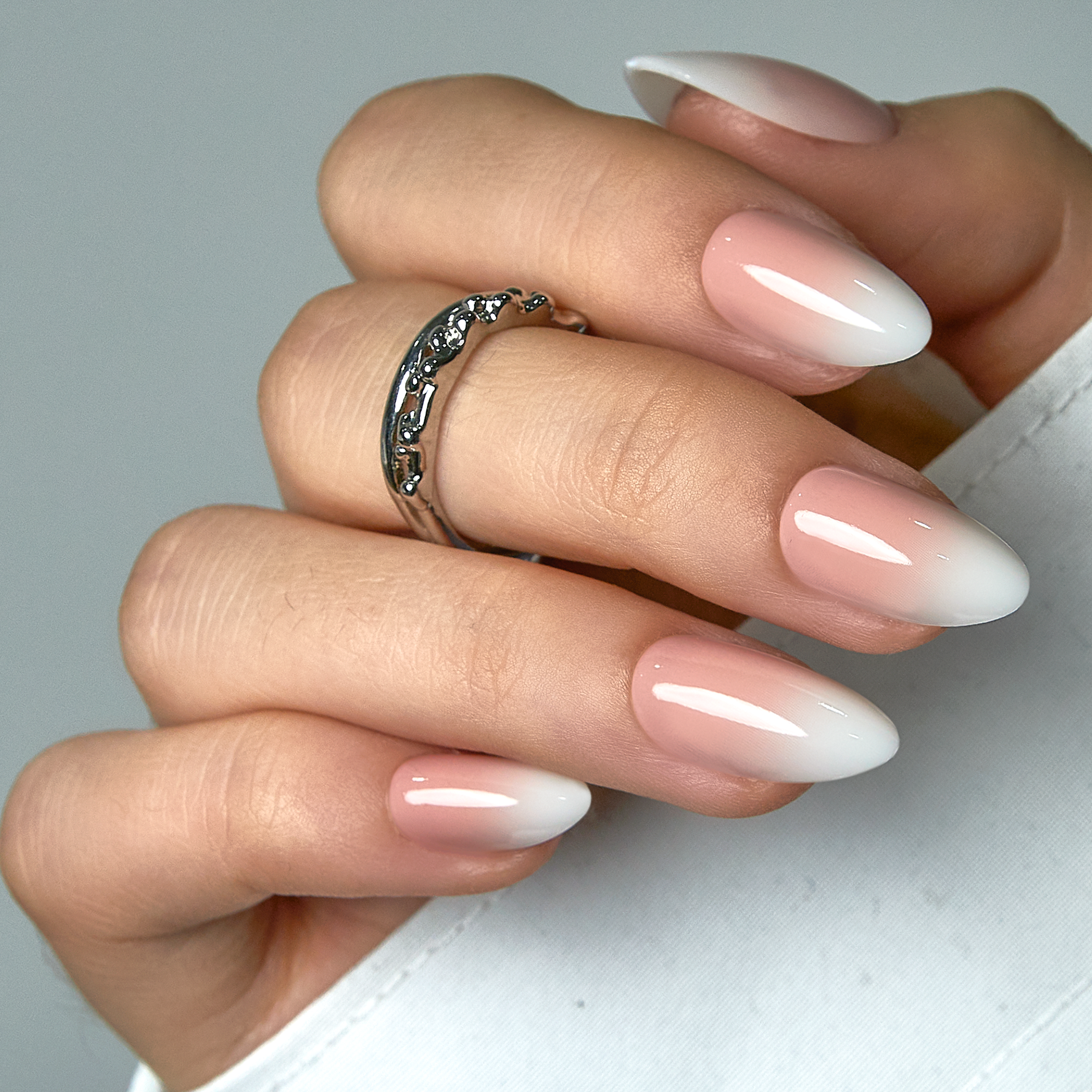 Nude Tips short almond nail detail