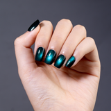 Ocean Beam Glow short squoval press-on nails worn on a hand