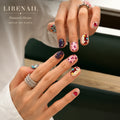 Lirenail Painted Heart press-on nails worn on a hand