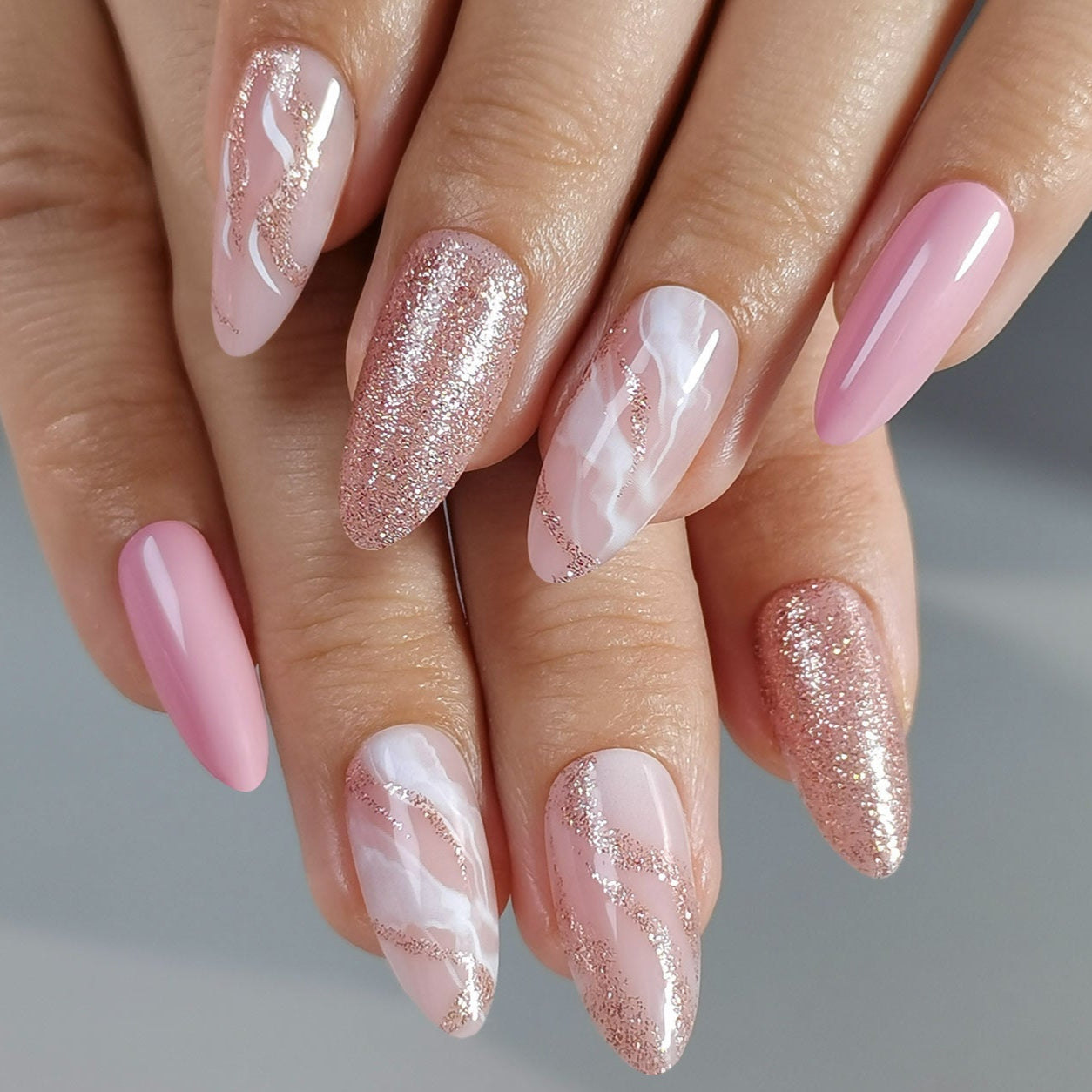 Pastel Shine L stiletto press-on nails worn on a hand