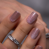 Pearl Veil short squoval press-on nails worn on a hand