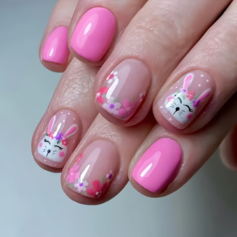 Pink Bunny short squoval press-on nails worn on a hand