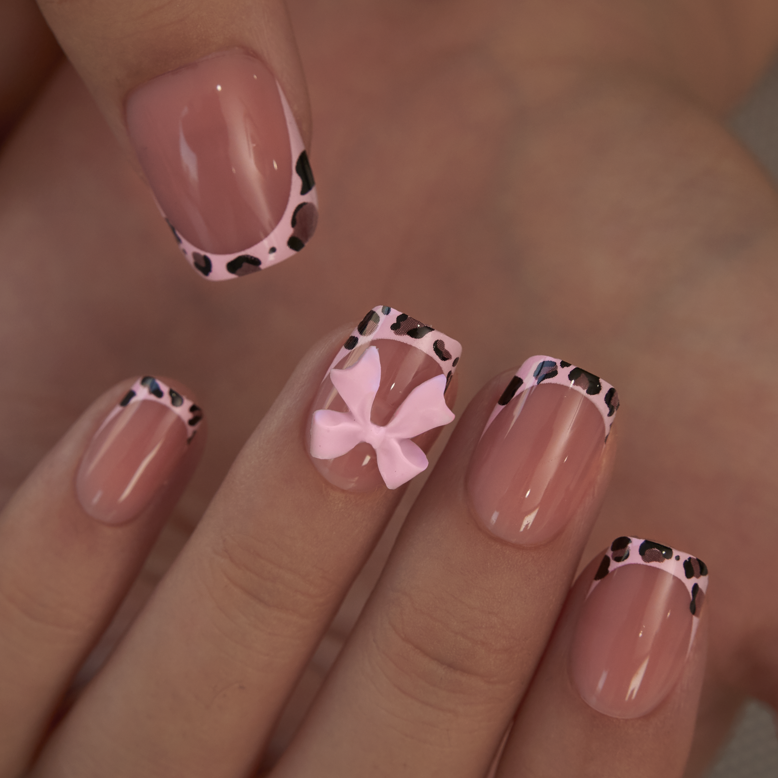 Pink Safari short squoval press-on nails from the side