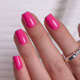 Pink Story short squoval press-on nails worn on a hand