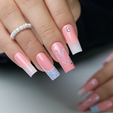 Pink Valentine long square press-on nails worn on a hand