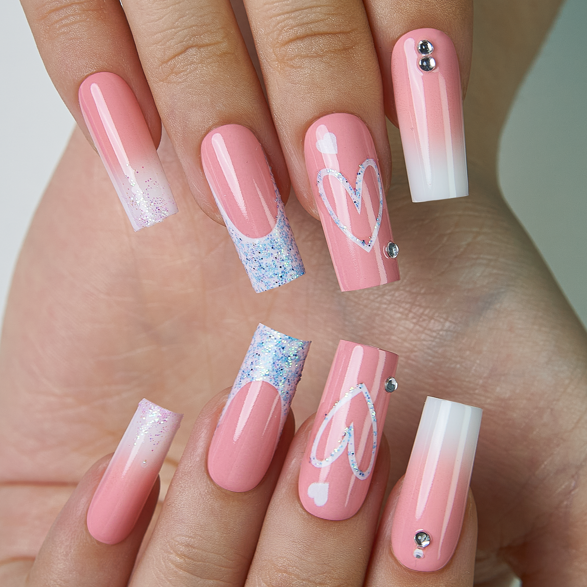 Pink Valentine long square press-on nails from the side