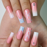 Pink Valentine long square press-on nails from the side
