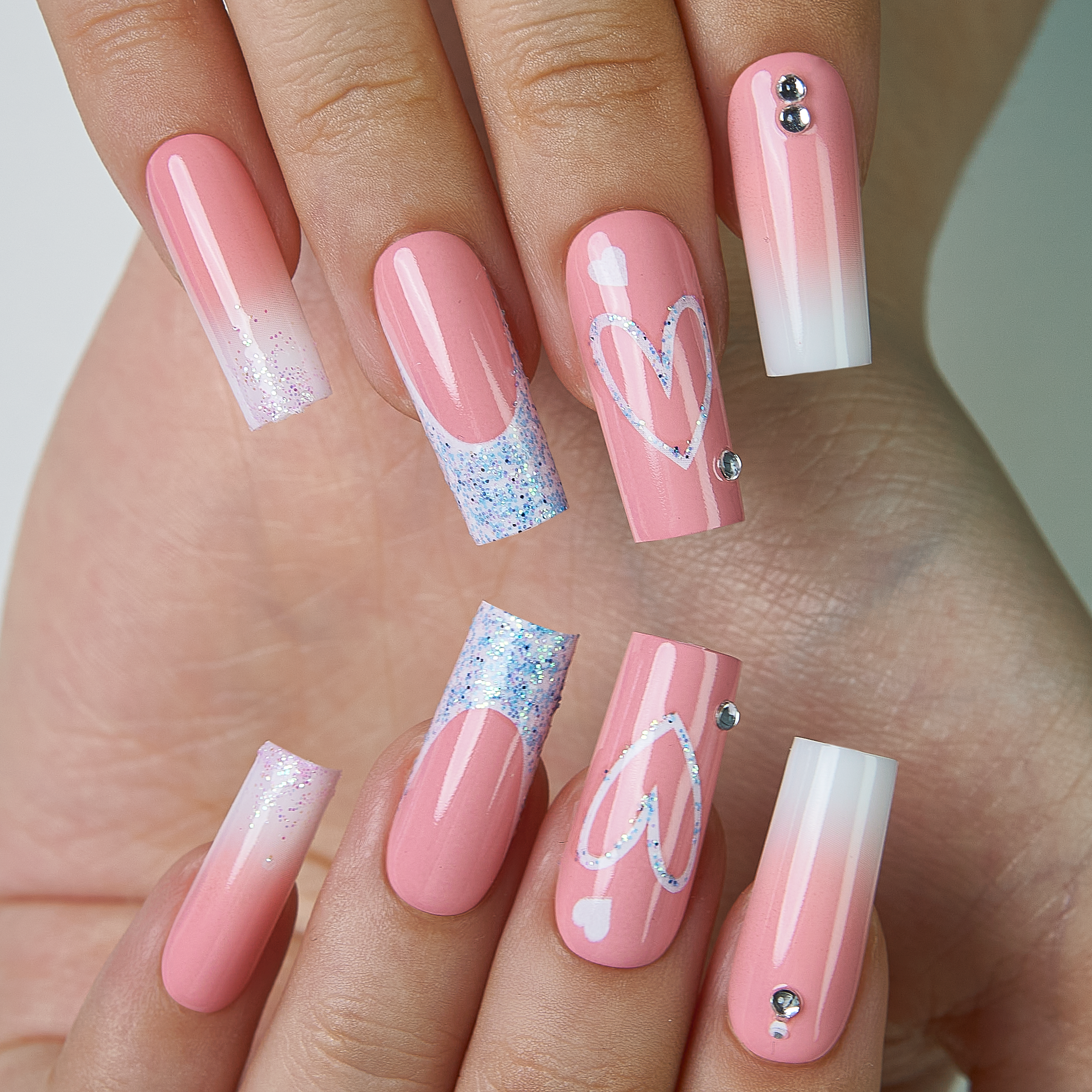 Pink Valentine long square press-on nails from the side