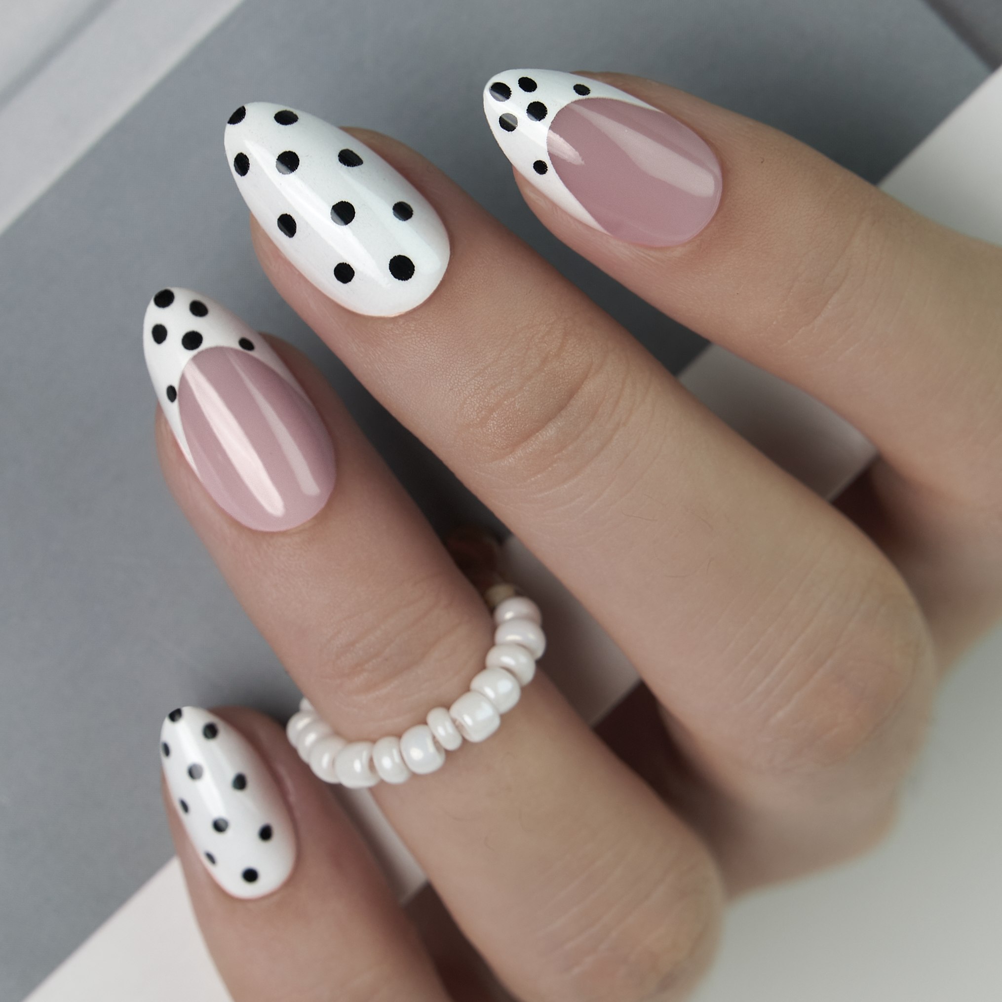 Playful French short almond press-on nails from the side