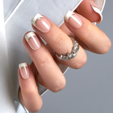 Pure Grace short squoval press-on nails worn on a hand