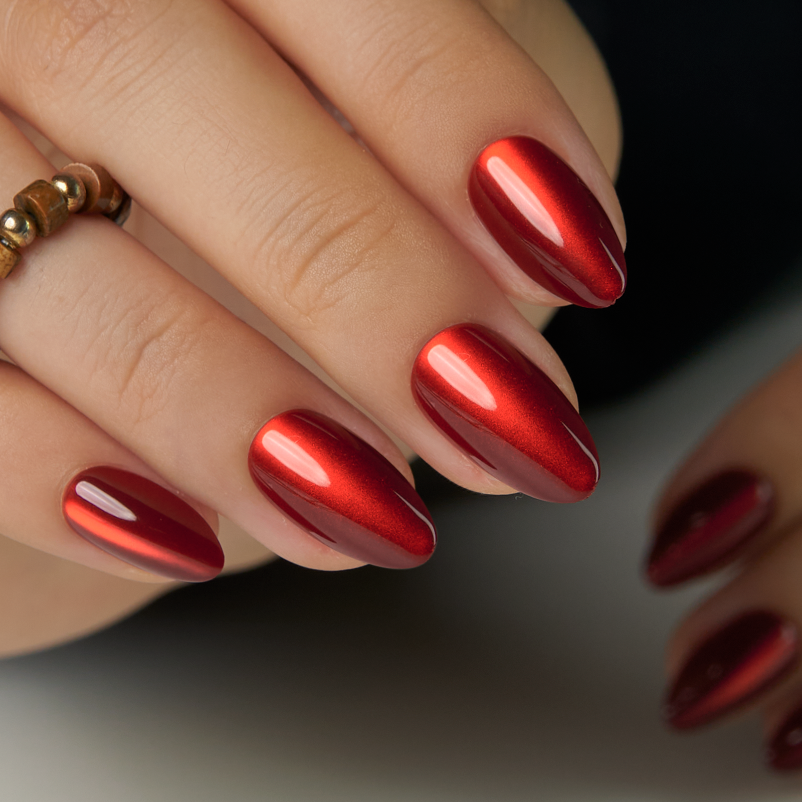 Red Eclipse short almond nail detail