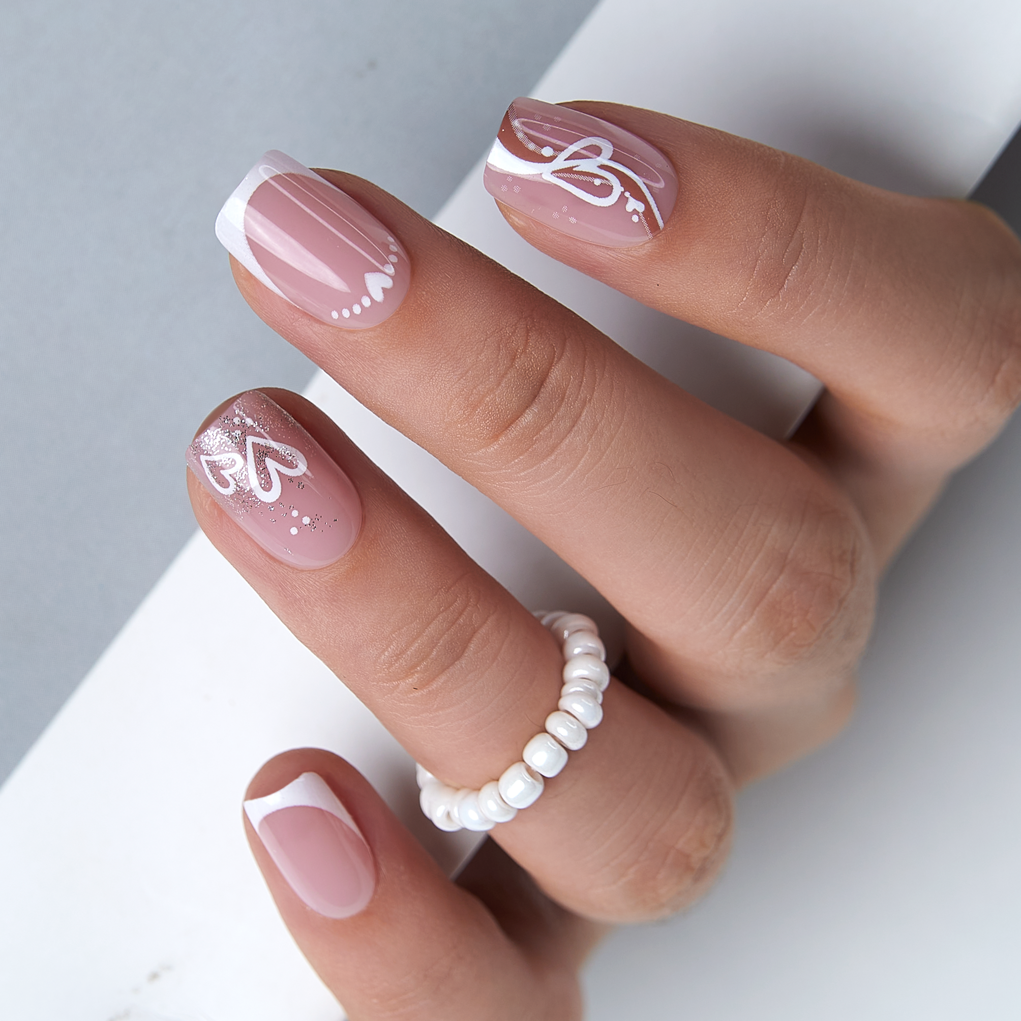 Romantic French short squoval press-on nails from the side