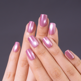 Rose Aurora short squoval press-on nails worn on a hand