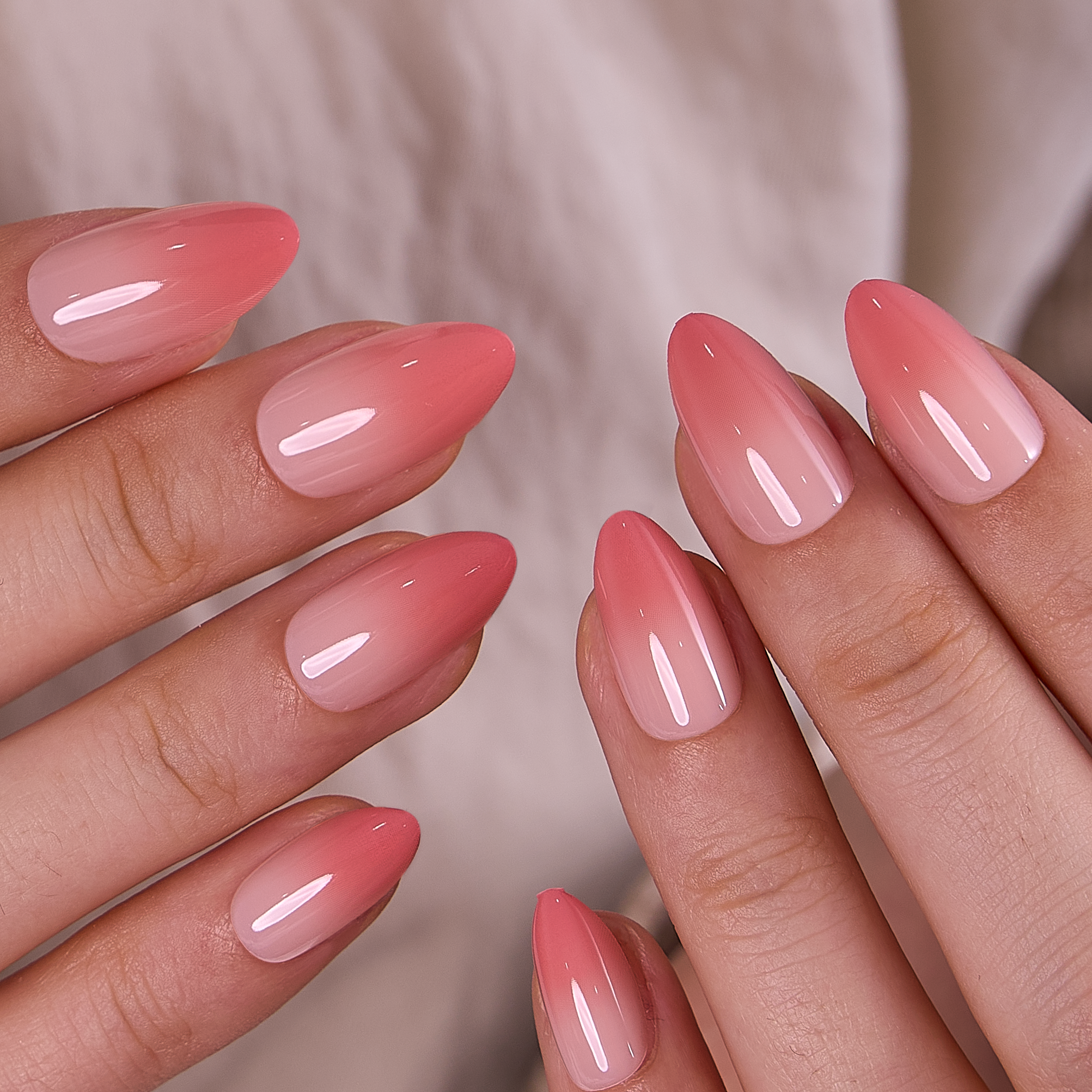 Rose Veil short almond press-on nails worn on a hand