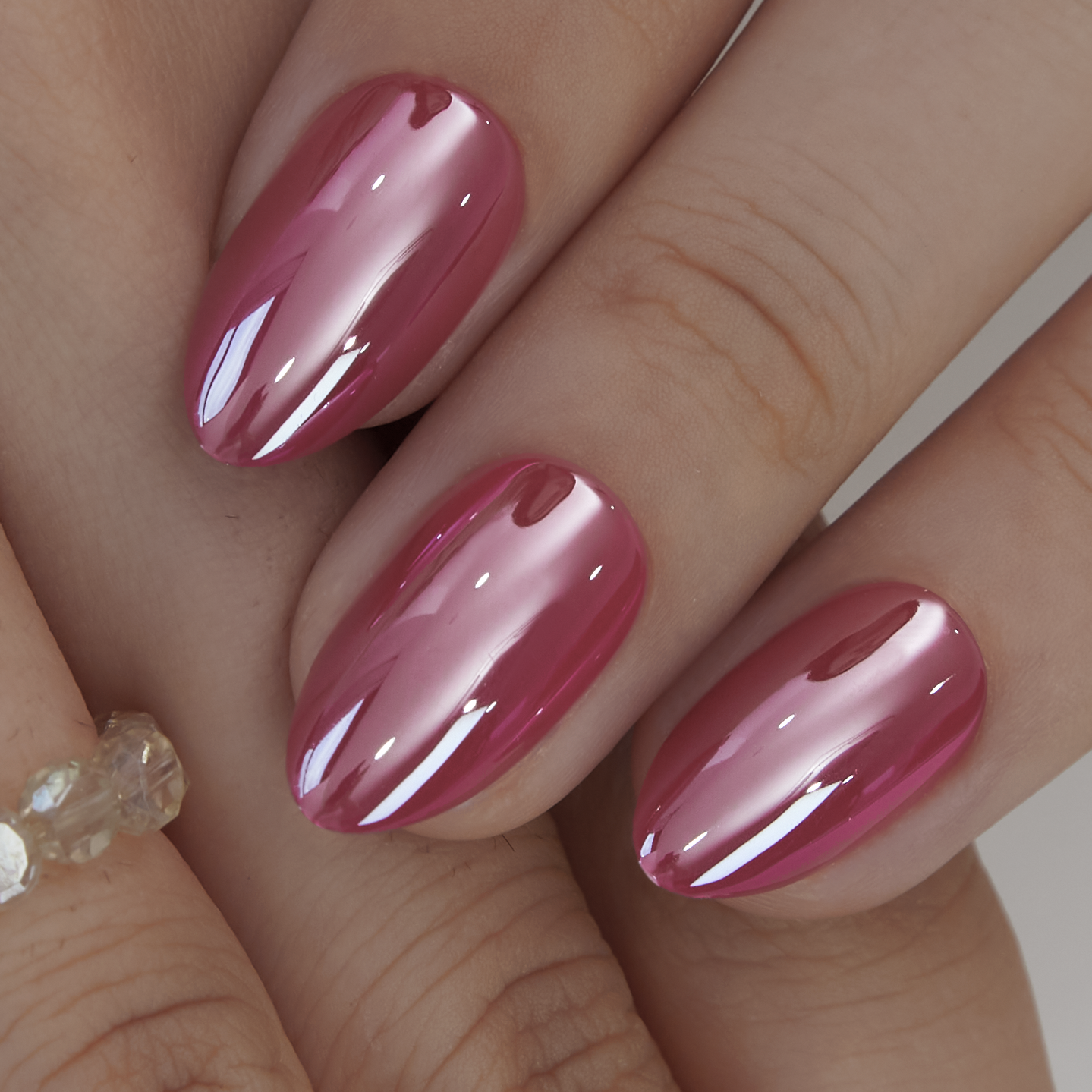Rosy Glow Shine short almond press-on nails from the side