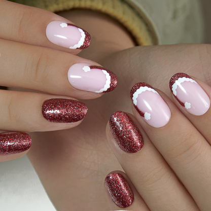 Ruby Charm medium oval press-on nails worn on a hand