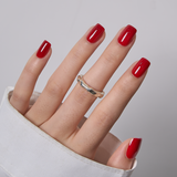 Ruby Winter short squoval press-on nails worn on a hand