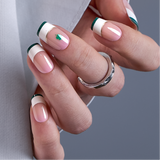 Shimmer Clover medium squoval press-on nails worn on a hand