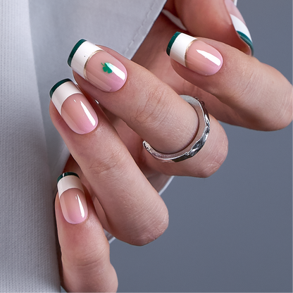 Shimmer Clover medium squoval press-on nails worn on a hand