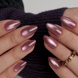 Shimmering Bliss short almond press-on nails worn on a hand