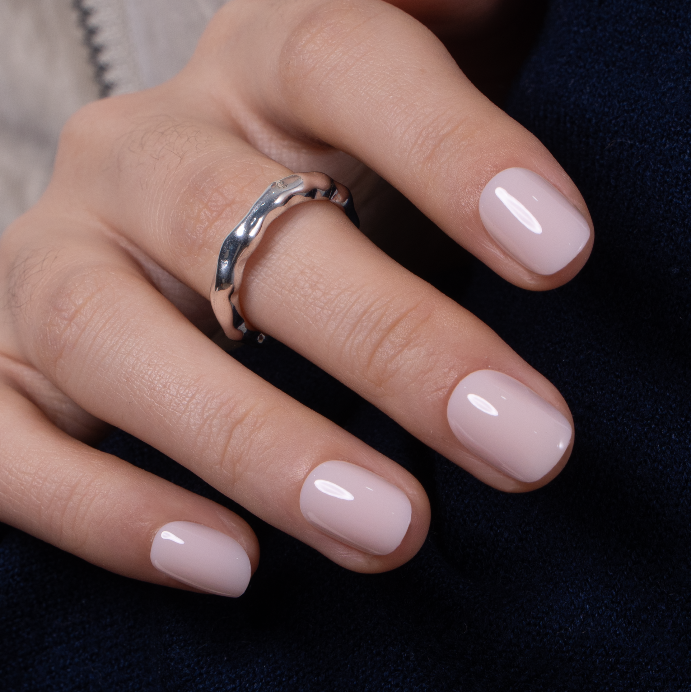 Soft Blush Matte Rs squoval press-on nails worn on a hand