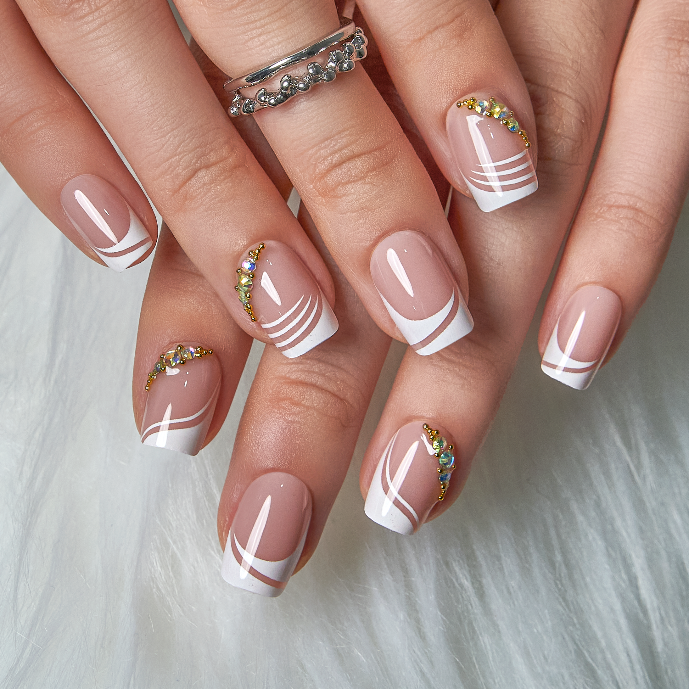 Soft Veil Luster short squoval press-on nails worn on a hand