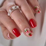 Strawberry Kiss medium square press-on nails worn on a hand