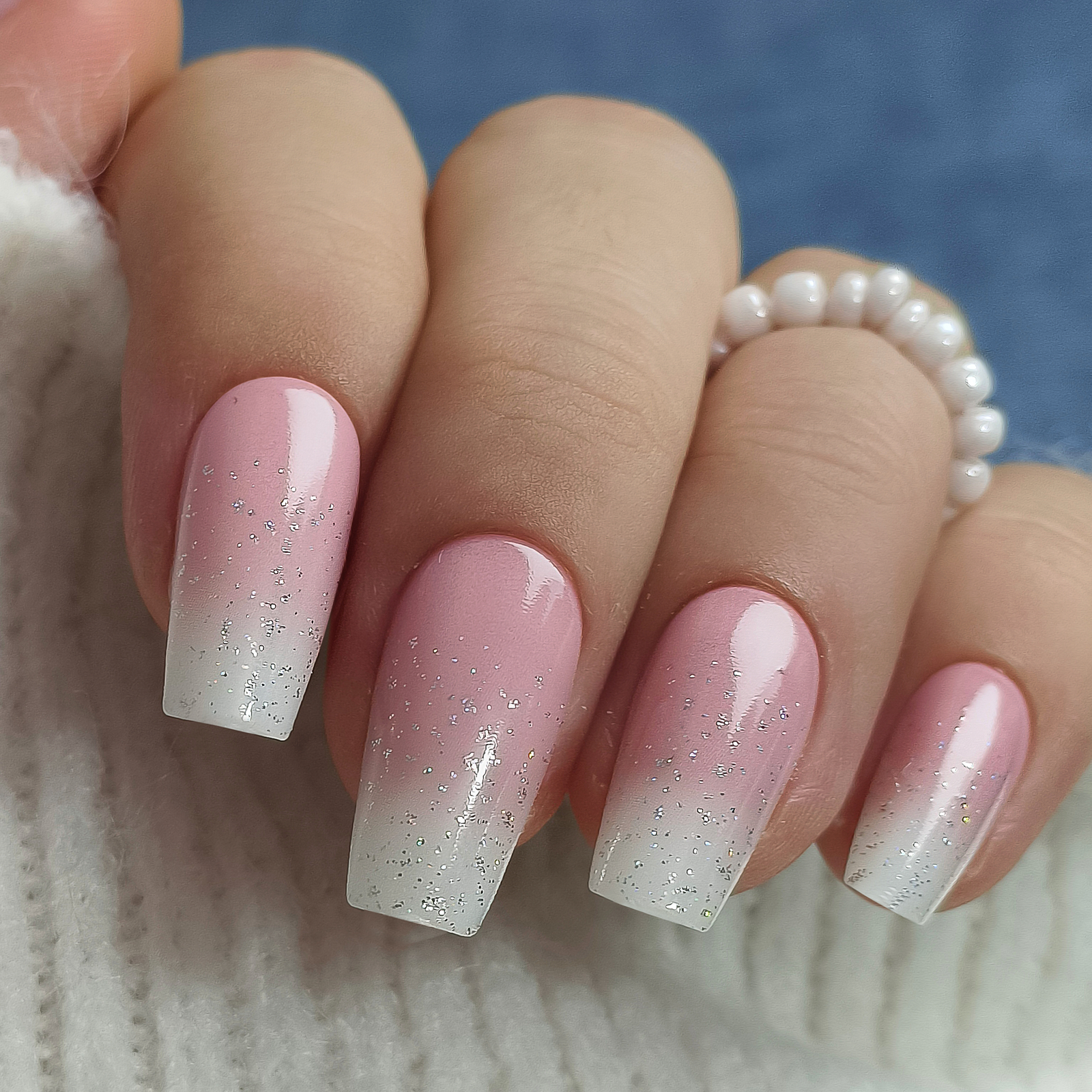 Subtle Glitter M Coffin press-on nails worn on a hand