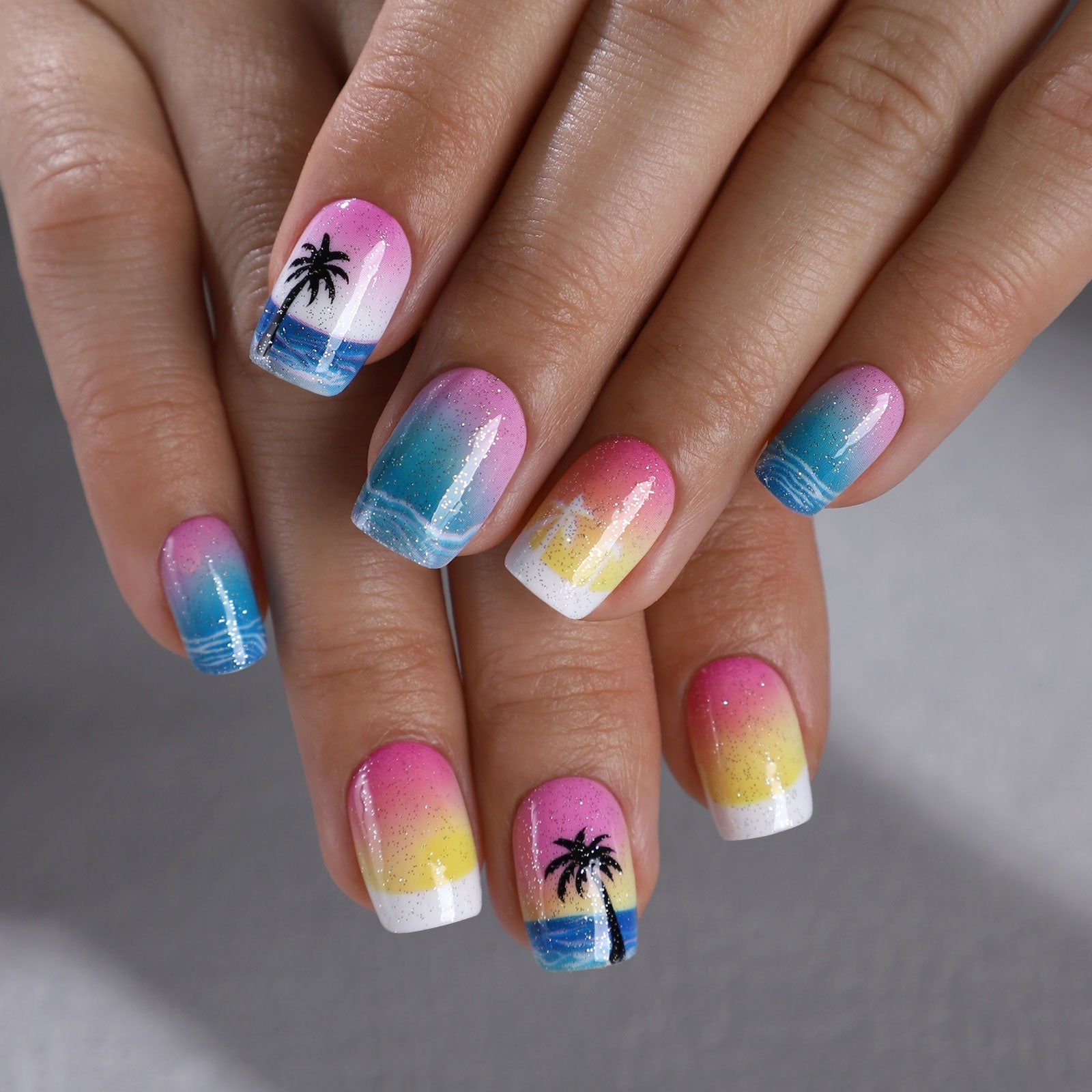 Summer Beach short squoval press-on nails worn on a hand