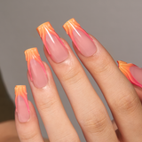 Sunset Ember long square press-on nails worn on a hand