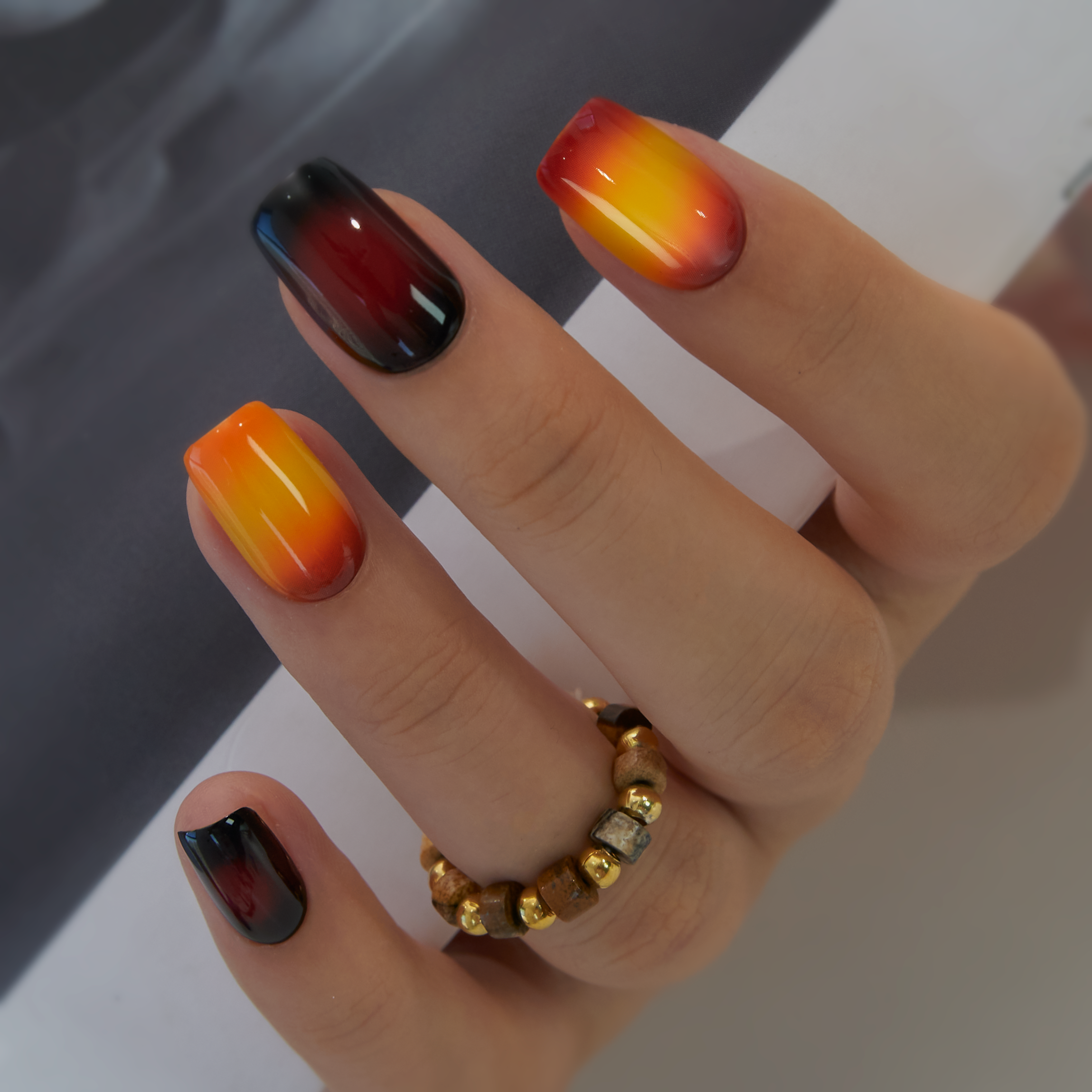Sunset Flame medium squoval press-on nails from the side