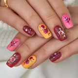Sweet Floral medium squoval press-on nails worn on a hand