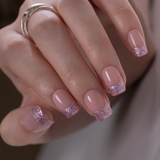 Sweet Pink Paris short squoval press-on nails worn on a hand