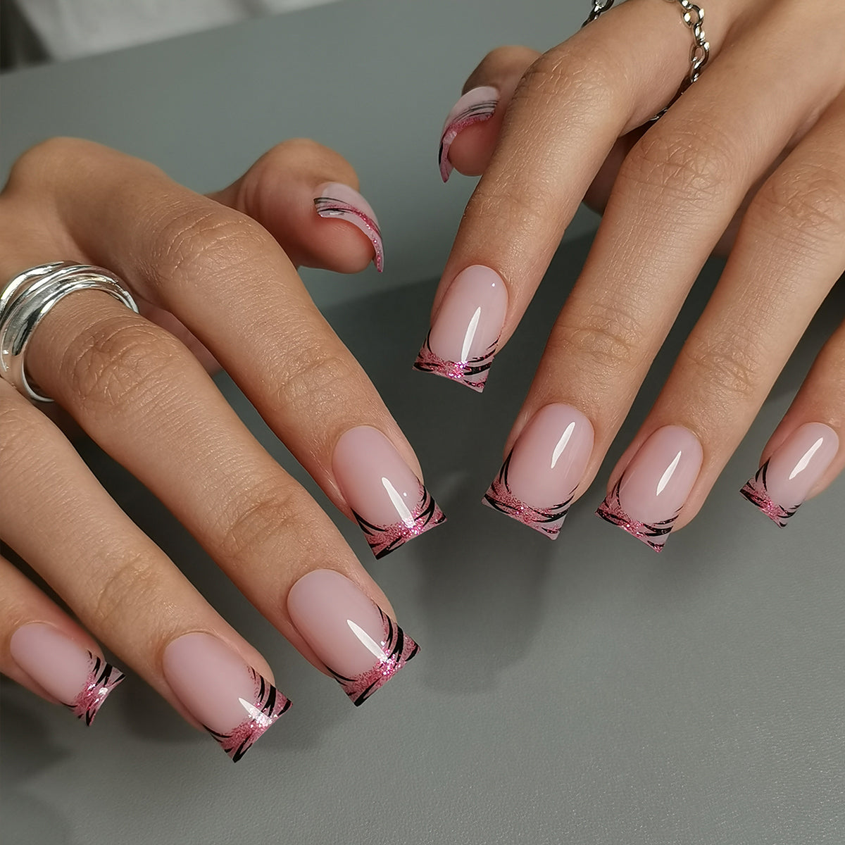 Sweet Wild M Duckbill press-on nails worn on a hand