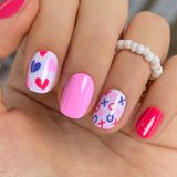 Sweetheart Shades Rs squoval press-on nails worn on a hand