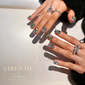 Lirenail Treasure rhinestone press-on nails worn on a hand