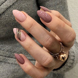 Twilight Candy short almond press-on nails worn on a hand