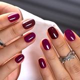 Velvet Fusion Rs squoval press-on nails worn on a hand