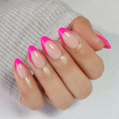 Vibrant Pink short almond press-on nails worn on a hand