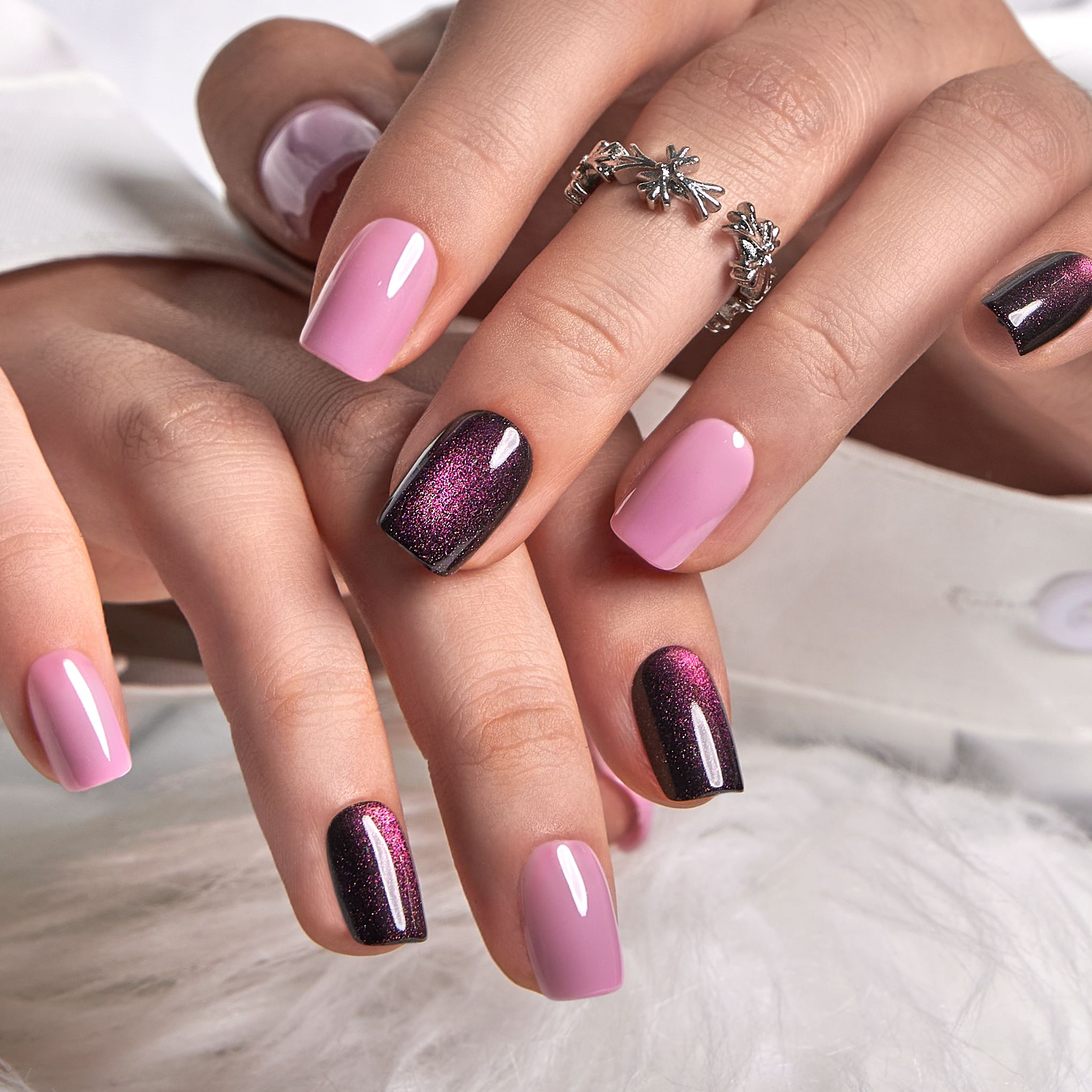 Violet Mirage short squoval press-on nails worn on a hand