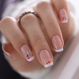 Vivid Dot Veil medium squoval press-on nails worn on a hand