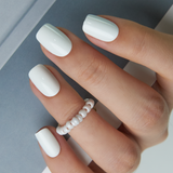 White Pearl medium squoval press-on nails from the side