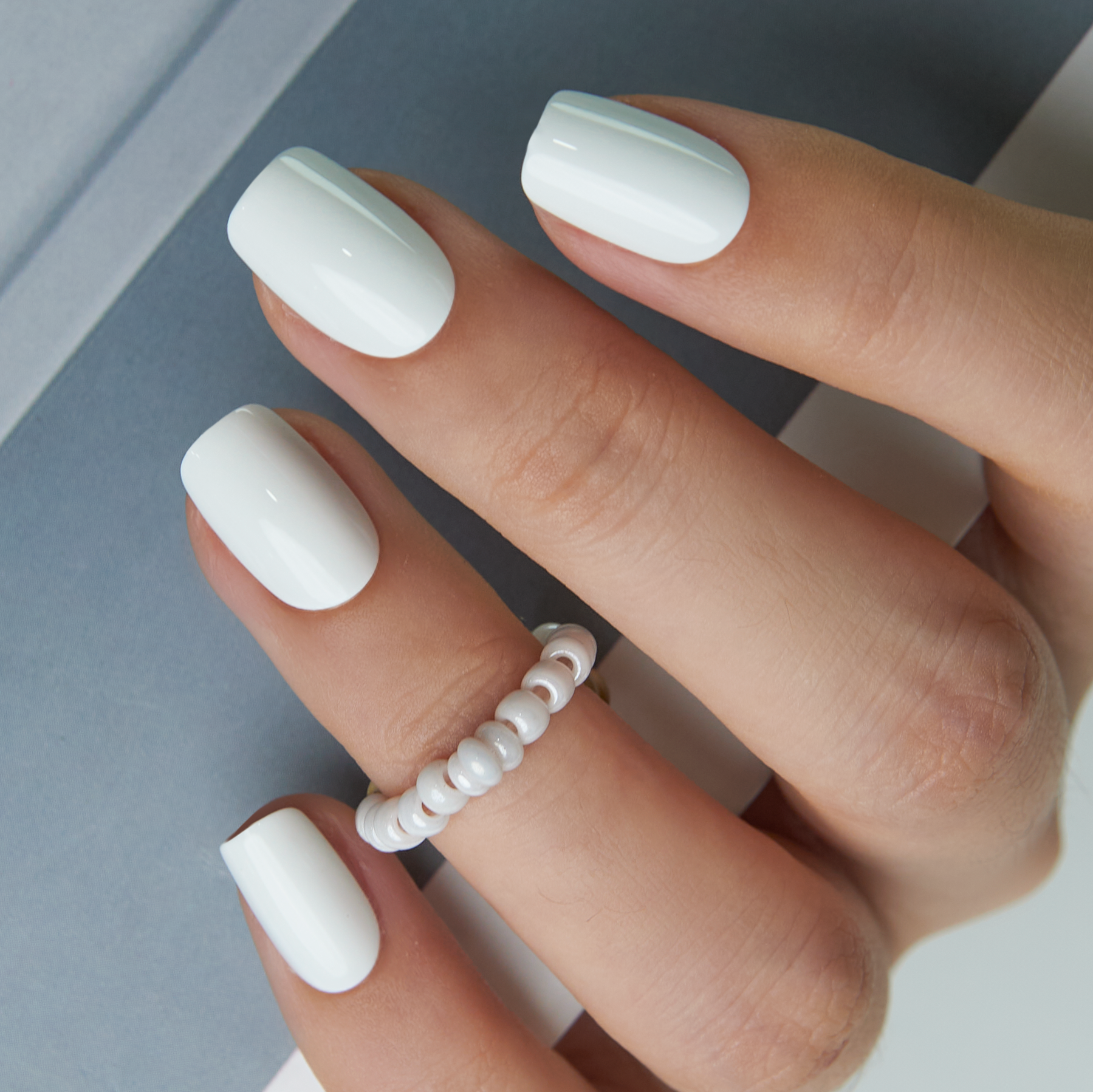 White Pearl medium squoval press-on nails from the side